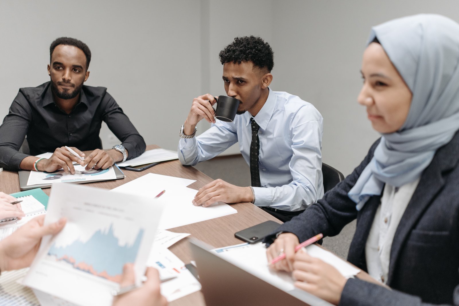 Business group reviewing documents together